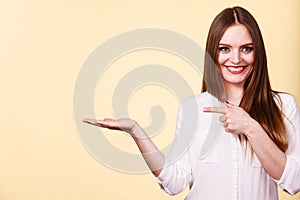 Woman holds empty hand copy space for product