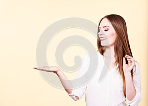 Woman holds empty hand copy space for product