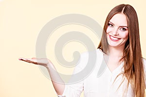 Woman holds empty hand copy space for product