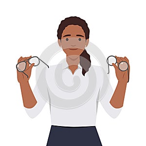 Woman holds glasses and lenses in hands choosing convenient and useful product for eye care