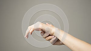 Woman holds her hand - pain concept