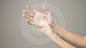 Woman holds her hand - pain concept