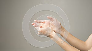 Woman holds her hand - pain concept