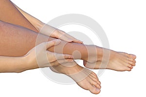Woman holds her leg with fingers of her hands