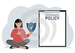 A woman holds an insurance policy sign in his hands. The concept of life insurance, property or natural disasters.