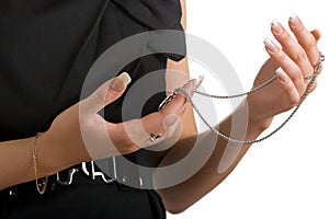 Woman holds a jeweller chain photo