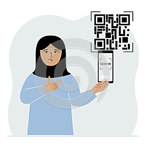 A woman holds a mobile phone in his hand with the text scan me and scans the qr code, which is located nearby.