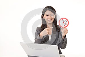 Woman holds non smoking sign