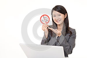 Woman holds non smoking sign