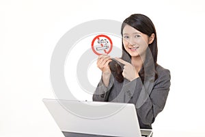 Woman holds non smoking sign