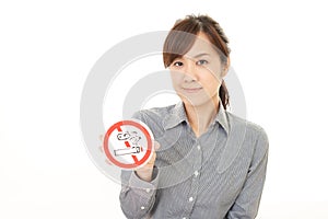 Woman holds non smoking sign