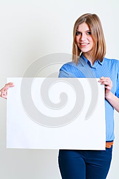 Woman holds out a big blank card