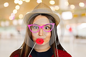 Woman holds photo prop