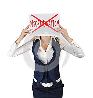 Woman holds a poster with the word crossed out discrimination