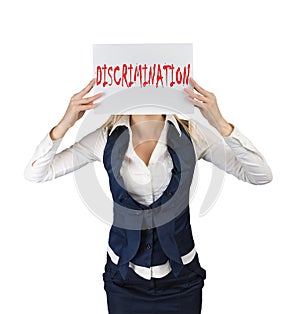Woman holds a poster with the word discrimination