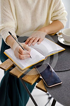 Woman holds smartphone in her hand