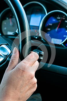 Woman holds the steering wheel