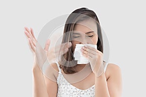The woman holds tissue cover her nose because she smell bad.