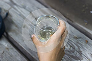 Woman holds a wine cup in her hand