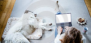 woman at home with dog hygge at Christmas time