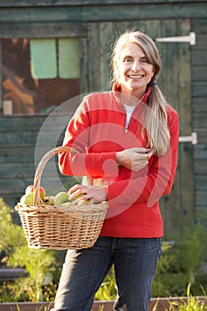 Woman with home-grown fruit photo