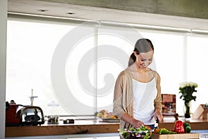 Woman, home and happy or preparing for salad with peppers, healthy or wellness or vegan. Female person, house or joyful