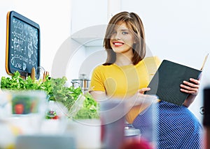Woman in home kitchen cooking bio diet