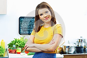 Woman in home kitchen cooking bio diet