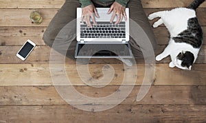 Woman at home on laptop top view