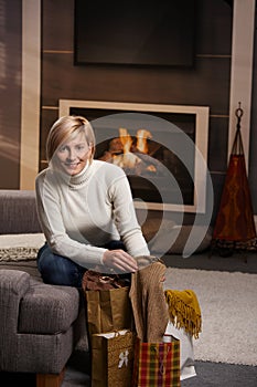 Woman at home with shopping bags