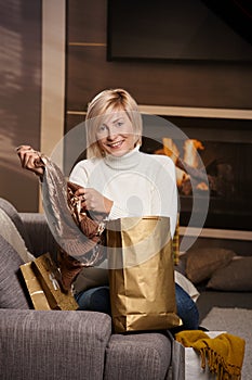 Woman at home with shopping bags