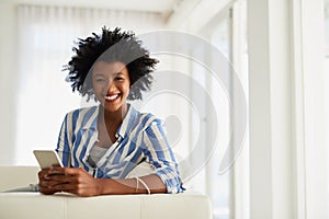 Woman, home and sofa for portrait with smartphone, technology and communication or texting and typing. Social media