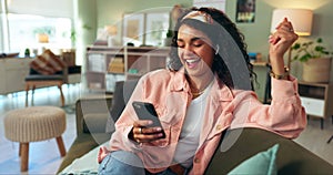 Woman, home and sofa on smartphone with music on earphones, playlist and happy for entertainment. Female person, lounge