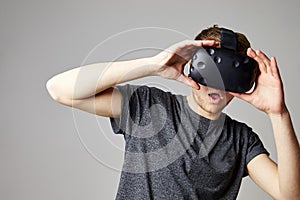 Woman At Home Wearing Virtual Reality Headset Playing Game