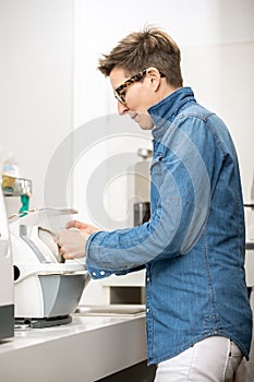 Woman hone the edge of the eyeglasses