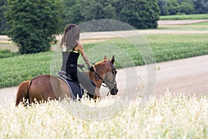 Woman on horse photo