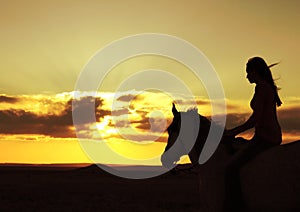 Woman and Horse Watching Sunset Silhouette