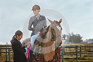 Woman, horse and winner of equestrian competition with ribbon award for sports achievement. Athlete person on animal for
