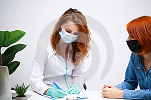 Woman at the hospital submits a blood test for a coronavirus