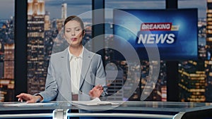 Woman host presenting newscast standing tv stage near screen. Lady breaking news