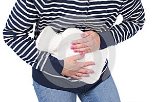 Woman with hot bottle and stomach pain