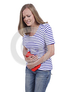 Woman with hot bottle and stomach pain