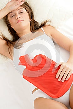 Woman with hot bottle water