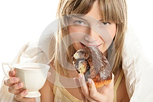 Woman with hot chocolate and cake