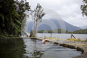 Woman in hot springs, natural scenery