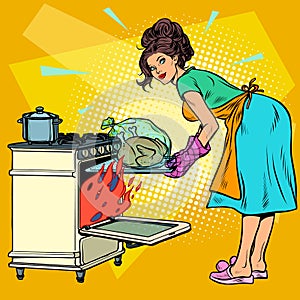 Woman housewife bakes bird in the oven