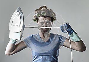 Woman or housewife sad bored and stressed holding iron angry and frustrated