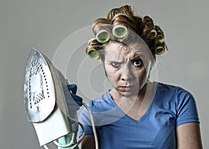 Woman or housewife sad bored and stressed holding iron angry and frustrated