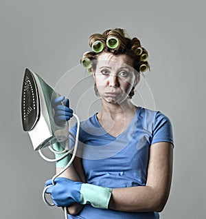 Woman or housewife sad bored and stressed holding iron angry and frustrated