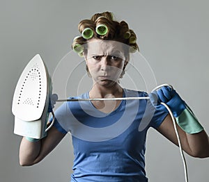 Woman or housewife sad bored and stressed holding iron angry and frustrated